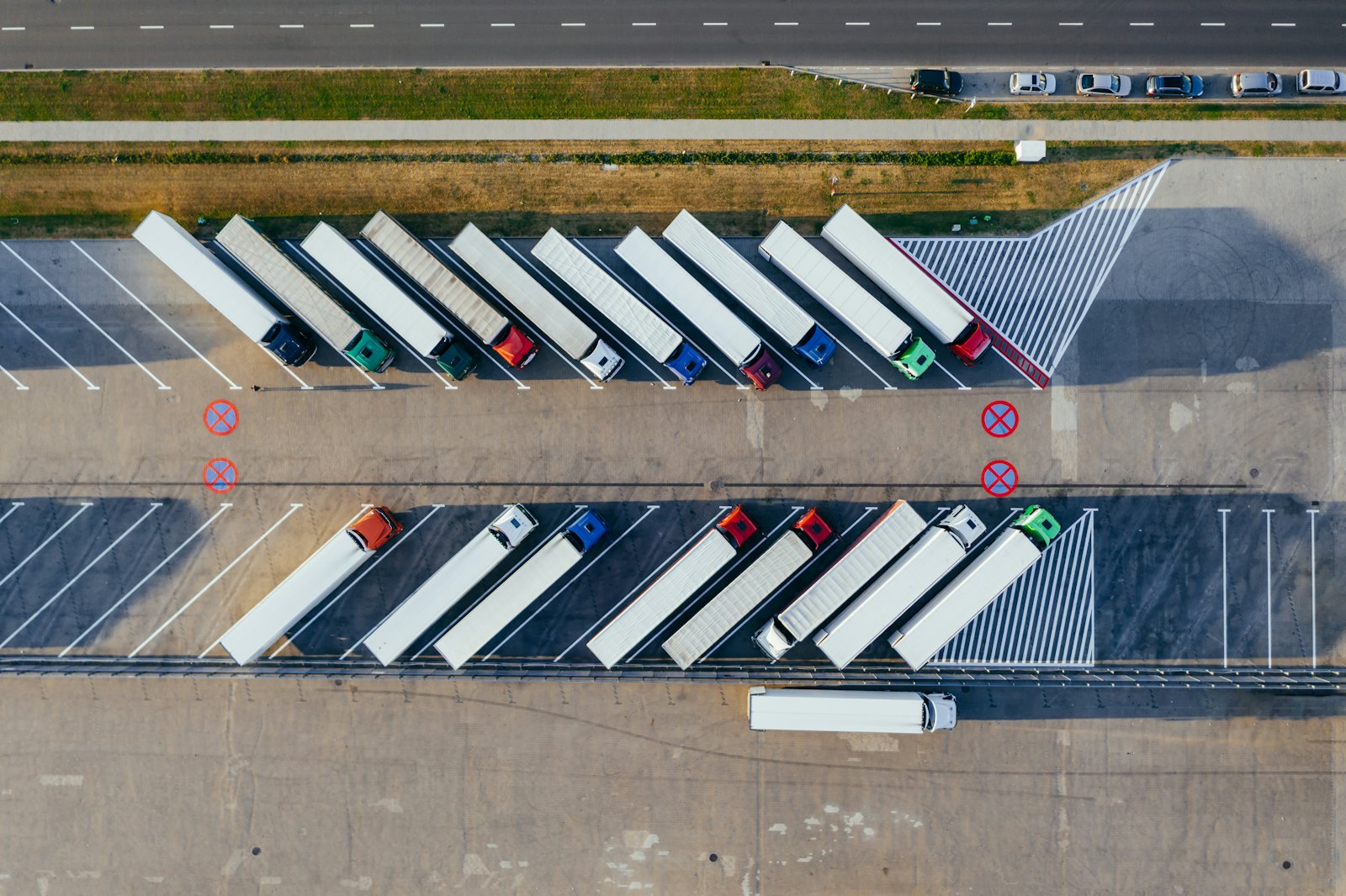Aerial view of cargo trucks loading at a logistics terminal for export