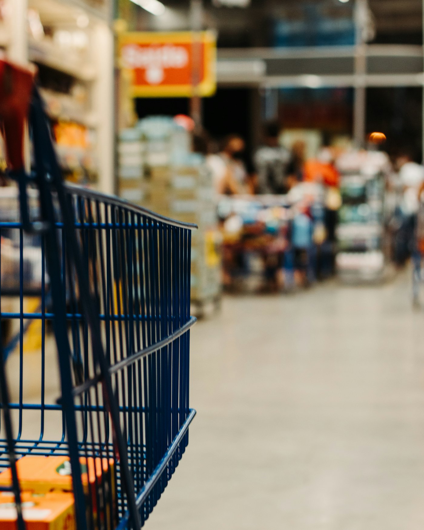 Retail store aisle with packaged consumer goods on shelves